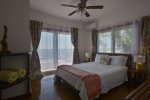 Master bedroom with queen bed and stunning sea views